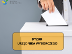 dłoń wrzucająca kartkę do urny na dole napis na pomarańczowym prostokącie dyżur urzednika wyborczegojące do Rady Sołeckiej w Rudniku